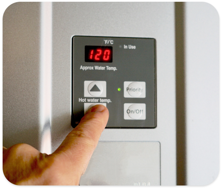 finger-on-hot-water-heater-control-unit-2022-11-16-00-04-45-utc.png